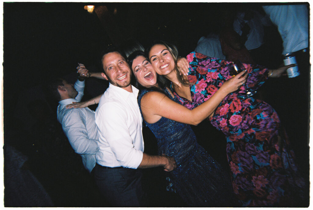 Disposable cameras used at wedding receptions result in candid images of guests.