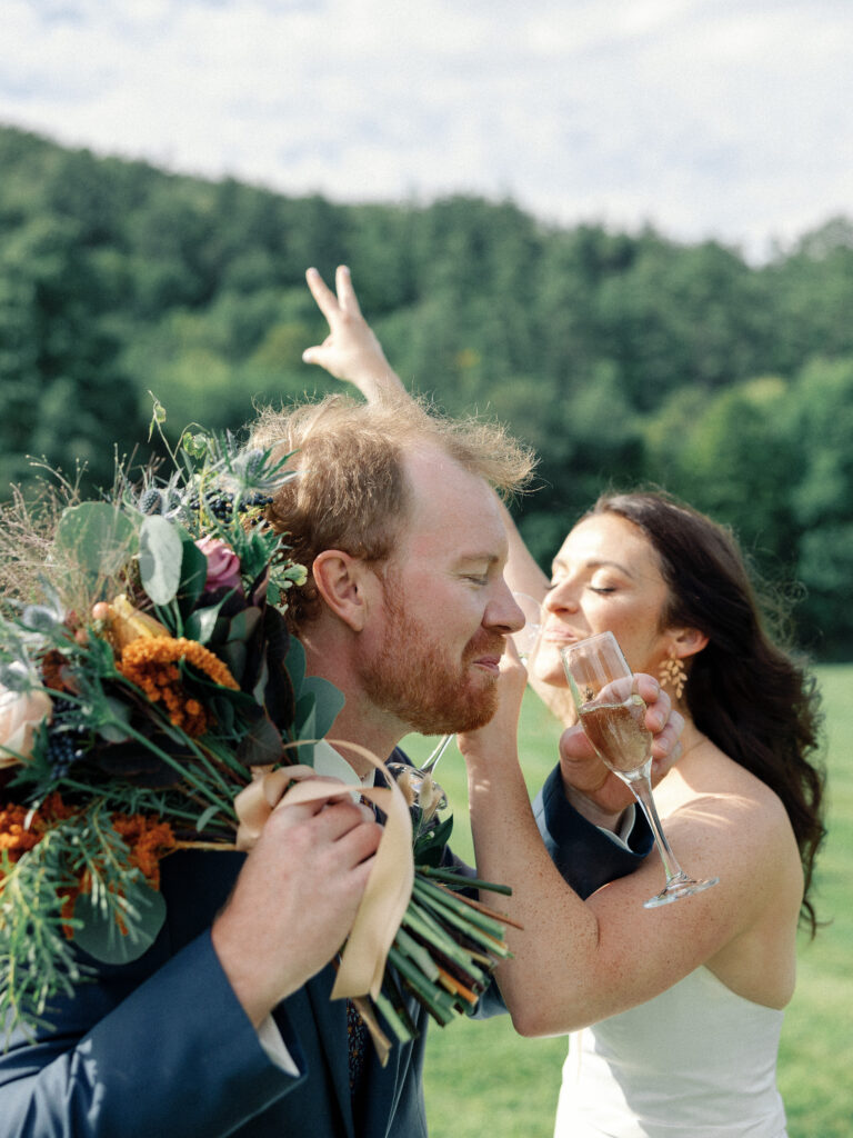 Fun wedding photographers in Vermont capture silly toast and lots of emotion.