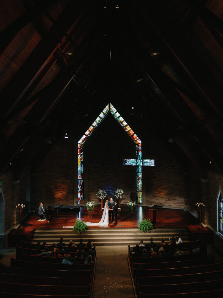 Cherry Hills community church wedding ceremony space inside the chapel with stained glass windows