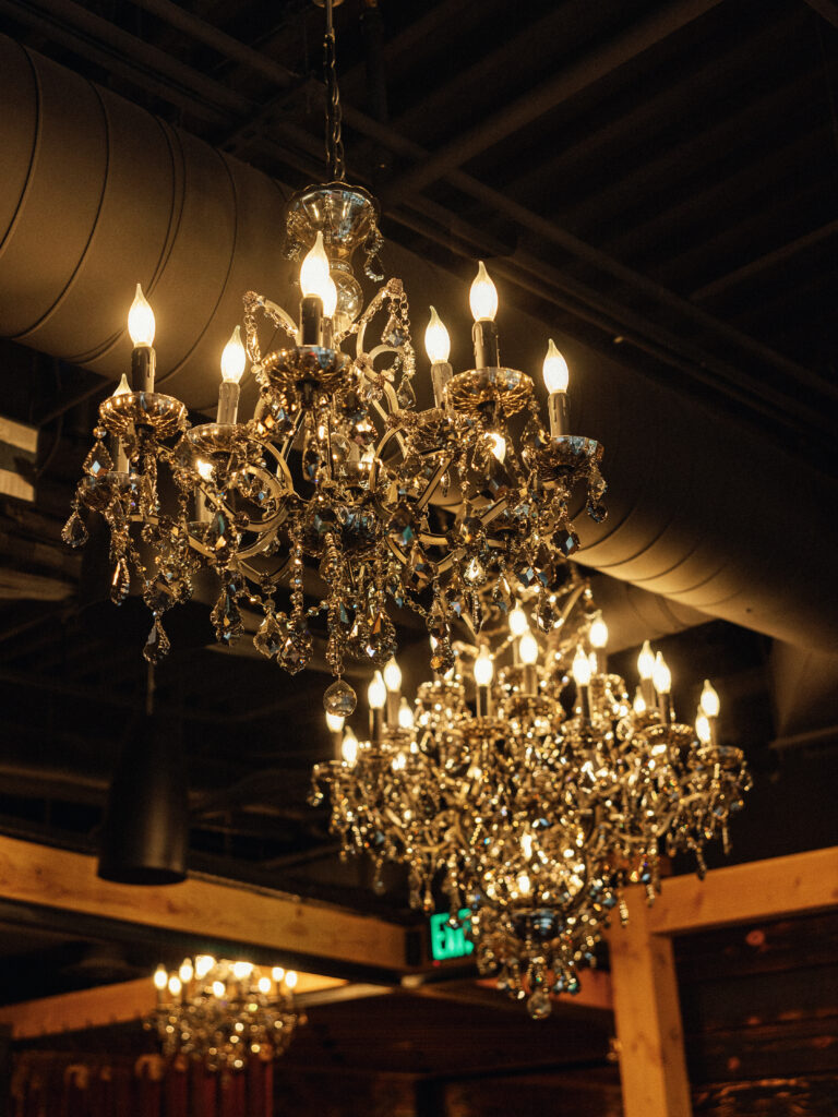 Shift Workspaces in Littleton, Denver, Colorado hosts a wedding reception with crystal chandeliers