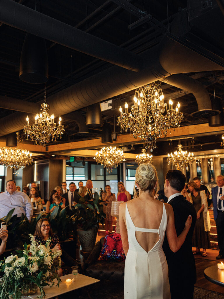 Bride and groom give a speech at their Denver wedding at Shift Workspaces