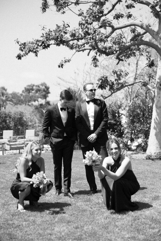Photojournalistic wedding photos of the wedding party waiting for photos to happen at a wedding in San Diego, California.