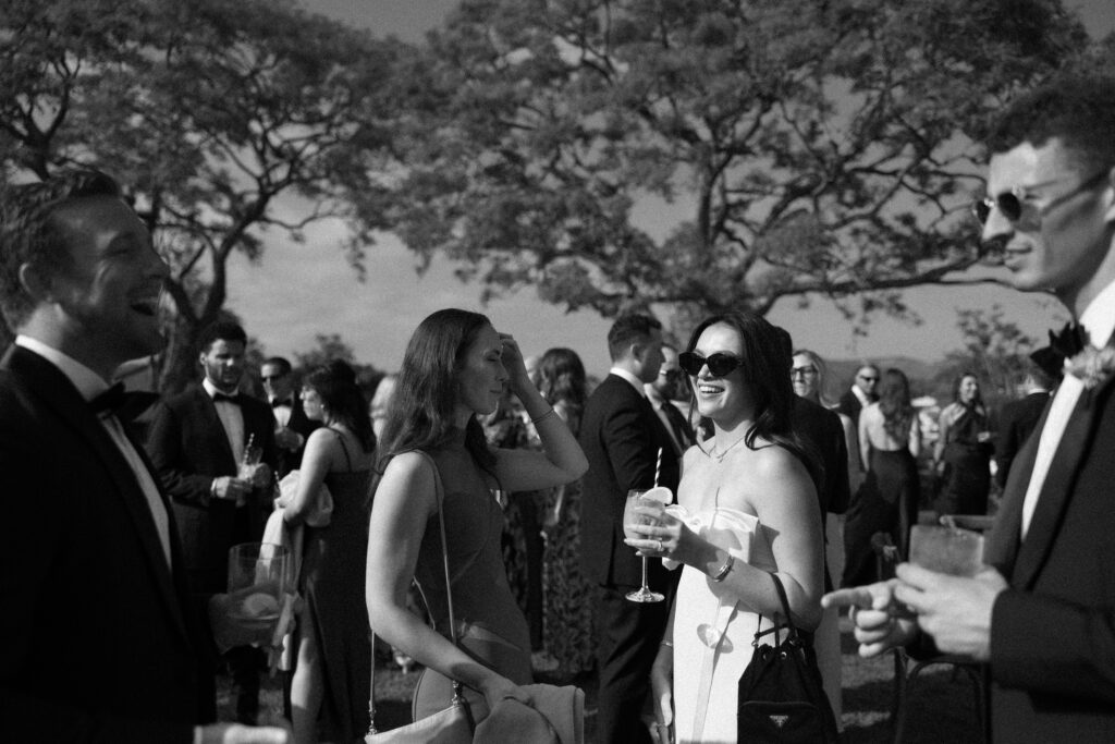 Layered image of two women talking to each other while to males also talk to each other.