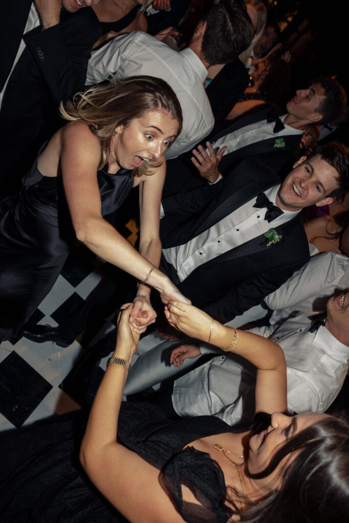 Wedding guests party on the dance floor at a wedding photographed by Kay Cushman.